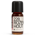 Een klein bruin glazen flesje met de tekst Natural Heroes essenstiële olie 228 ROZEN HOUT 
